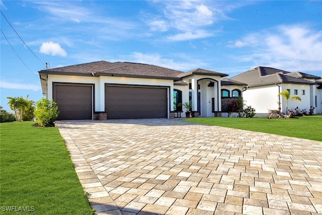 view of front facade featuring a front lawn and a garage