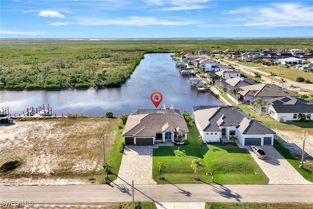 drone / aerial view with a water view