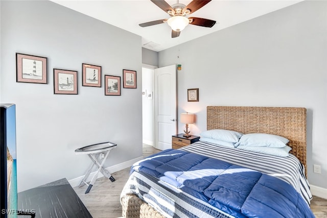 bedroom featuring ceiling fan and light wood-type flooring