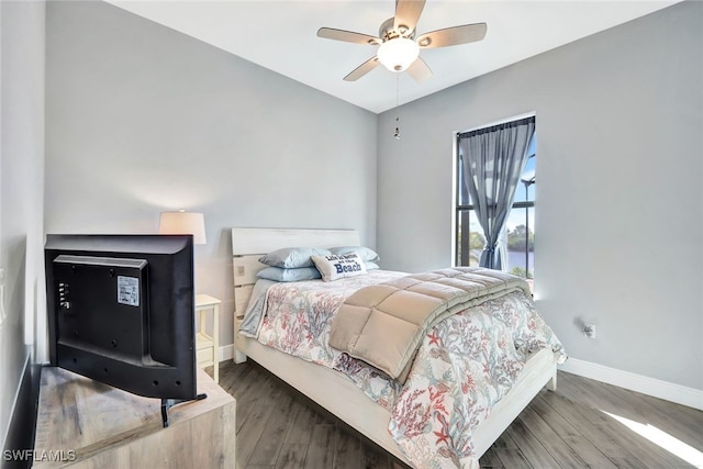 bedroom with ceiling fan and wood-type flooring