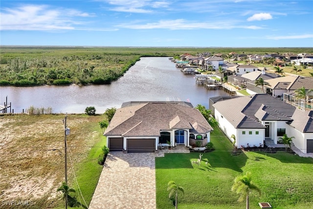 birds eye view of property featuring a water view