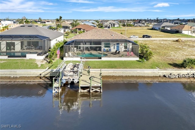 view of dock with glass enclosure, a water view, and a patio