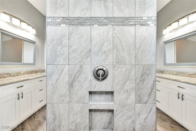 bathroom with vanity and hardwood / wood-style flooring