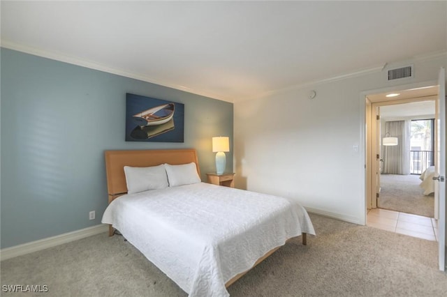 carpeted bedroom featuring crown molding