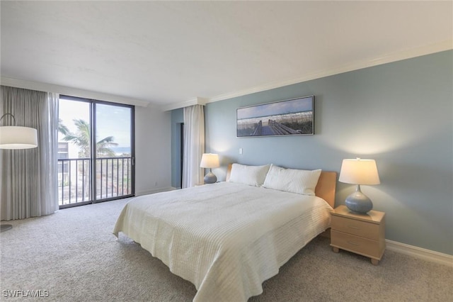 carpeted bedroom featuring access to exterior and crown molding