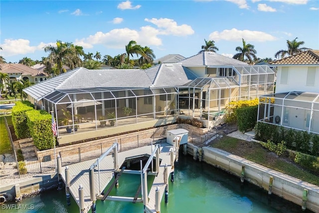 view of dock featuring a water view and a lanai