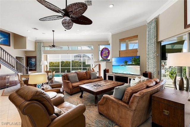 living room featuring crown molding, light tile patterned flooring, and ceiling fan