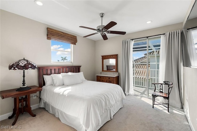 carpeted bedroom with ceiling fan and access to exterior