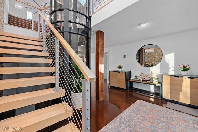 stairs featuring an inviting chandelier