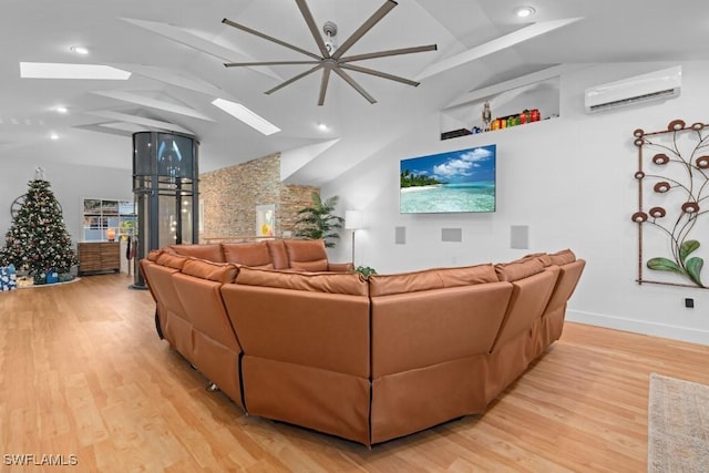 living room featuring light hardwood / wood-style floors, an AC wall unit, and lofted ceiling