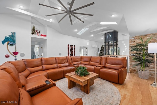 living room featuring light hardwood / wood-style floors and high vaulted ceiling