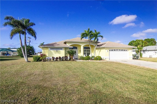 view of front of home with a garage and a front yard