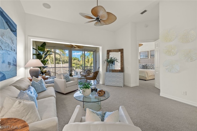 carpeted living room featuring ceiling fan