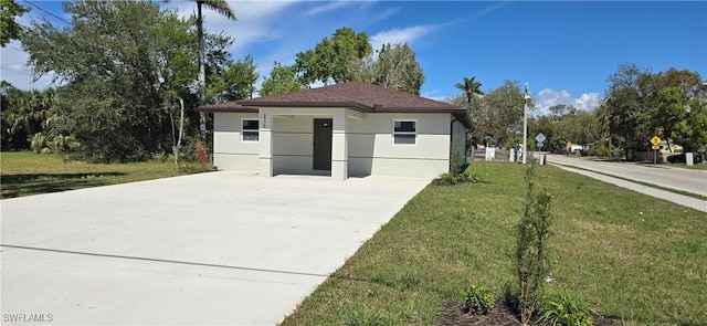 view of property exterior featuring a yard and stucco siding