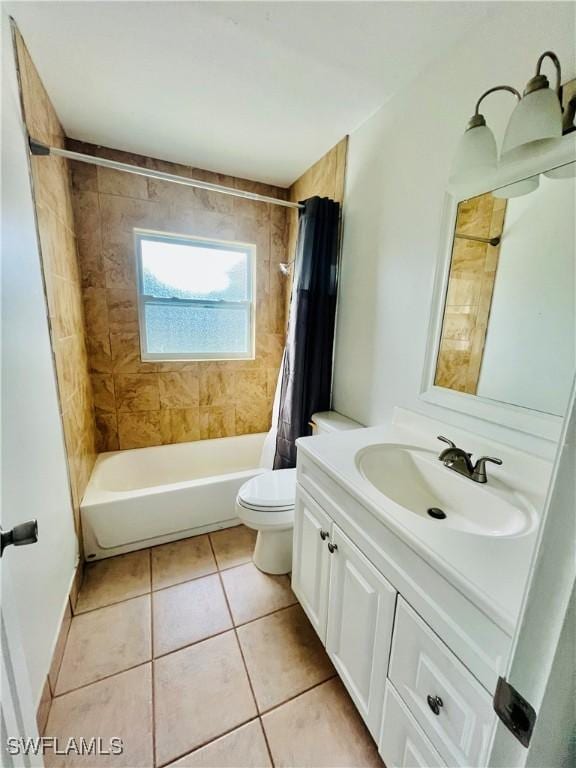 full bathroom featuring tile patterned flooring, vanity, toilet, and shower / bath combo