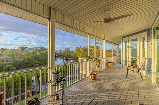 wooden terrace featuring ceiling fan