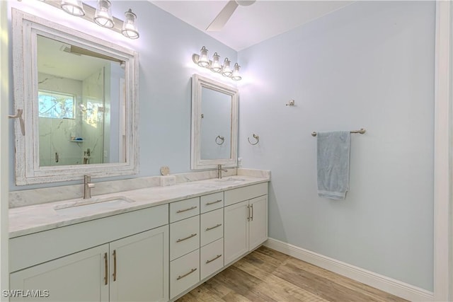 bathroom featuring hardwood / wood-style flooring, vanity, ceiling fan, and walk in shower