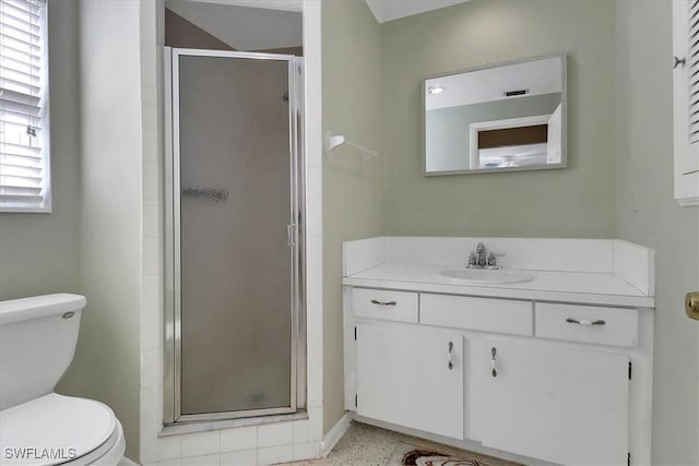 bathroom with toilet, an enclosed shower, and vanity