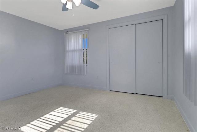 unfurnished bedroom featuring a closet and ceiling fan