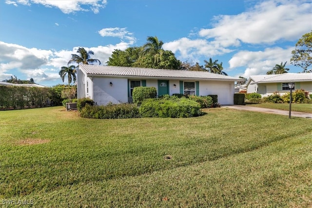 single story home with a front lawn