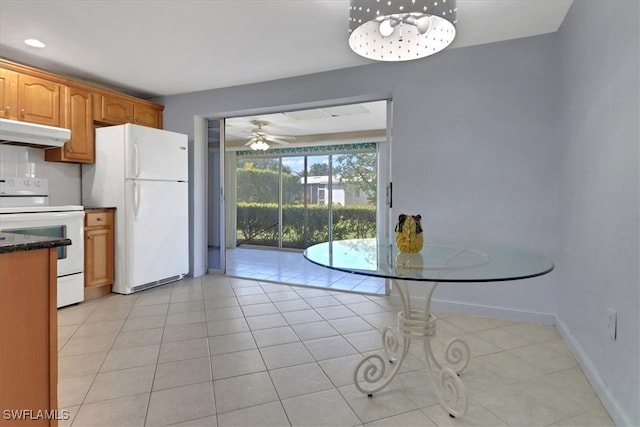 kitchen featuring ceiling fan, white appliances, and light tile patterned floors