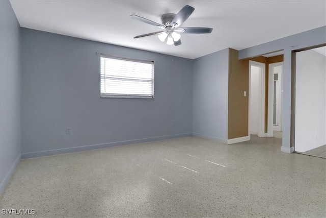 unfurnished room with ceiling fan