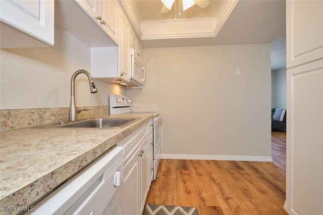 kitchen featuring white cabinetry, ornamental molding, white appliances, and light wood-type flooring