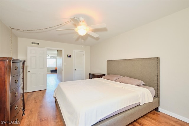 bedroom featuring ceiling fan and wood-type flooring