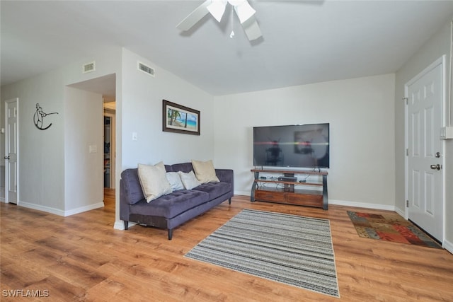 living room with hardwood / wood-style flooring and ceiling fan