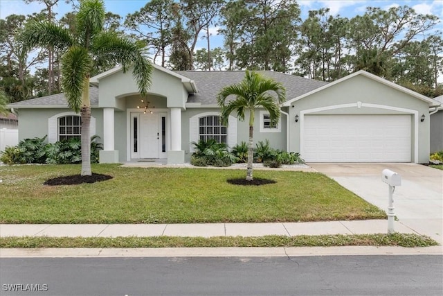 ranch-style home featuring a front yard and a garage