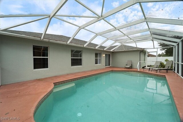 view of pool featuring a patio area and a lanai