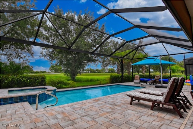 view of swimming pool featuring a patio area, a lanai, and an in ground hot tub