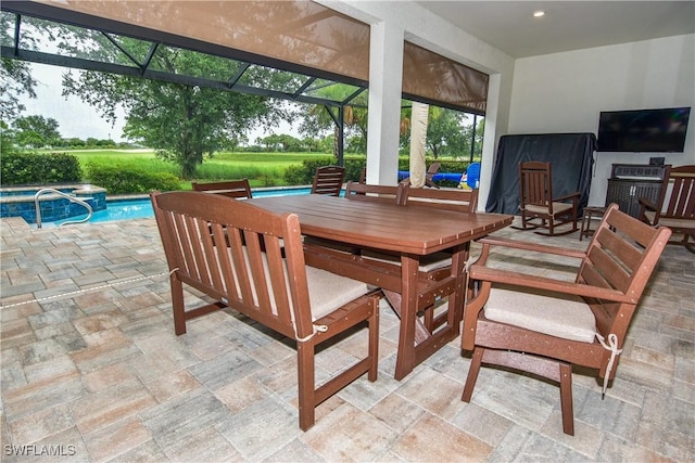 view of patio with glass enclosure