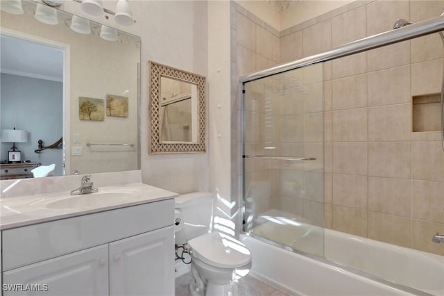 full bathroom featuring vanity, toilet, and bath / shower combo with glass door