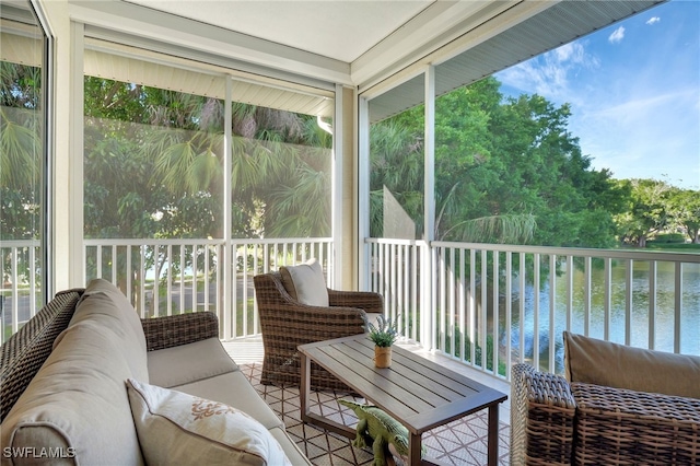 sunroom / solarium with a water view