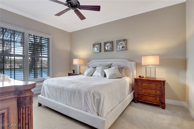 bedroom featuring light carpet, ceiling fan, and ornamental molding