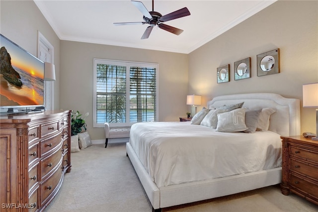 bedroom featuring ceiling fan, light colored carpet, and ornamental molding