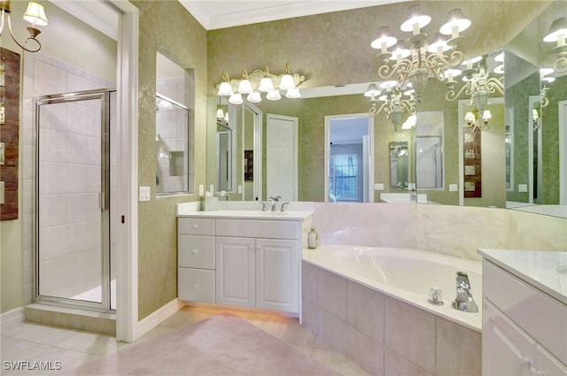 bathroom with tile patterned floors, vanity, separate shower and tub, crown molding, and a chandelier