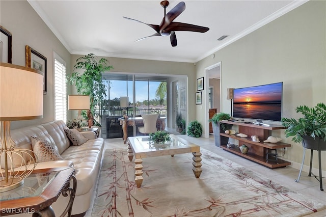 living room featuring ceiling fan, light tile patterned flooring, and ornamental molding