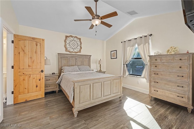 bedroom featuring dark hardwood / wood-style floors, ceiling fan, and lofted ceiling