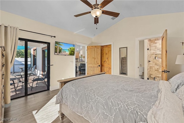 bedroom featuring ceiling fan, ensuite bathroom, hardwood / wood-style floors, vaulted ceiling, and access to outside