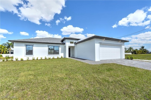 view of front of property featuring a garage and a front yard