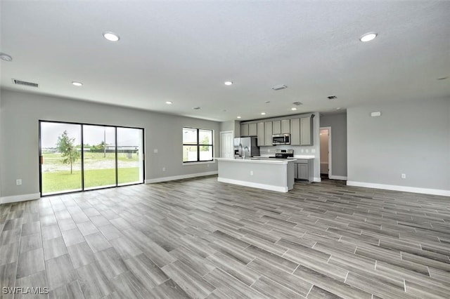 unfurnished living room featuring light hardwood / wood-style flooring