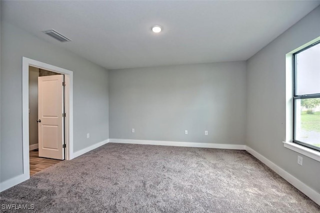 spare room featuring carpet floors