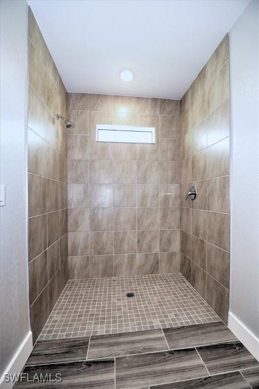 bathroom with tiled shower