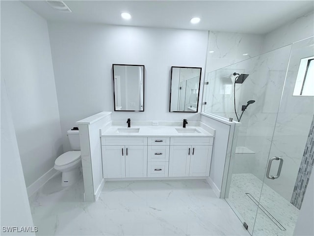 bathroom with a shower with door, vanity, and toilet