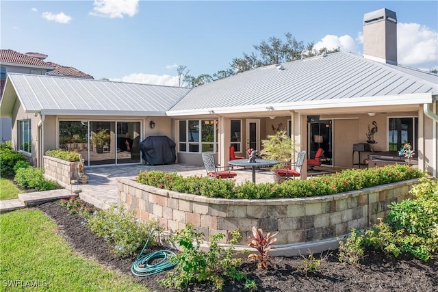 back of house featuring a patio