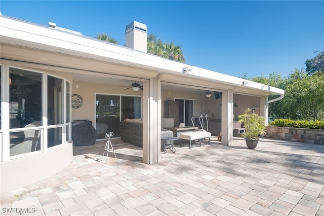 view of patio featuring outdoor lounge area and ceiling fan