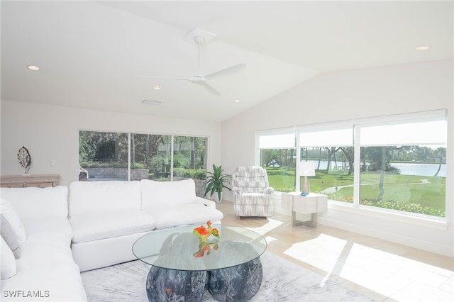 living room with ceiling fan and vaulted ceiling