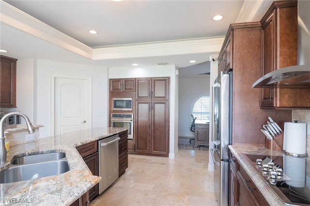 kitchen with wall chimney range hood, crown molding, sink, light stone countertops, and stainless steel appliances